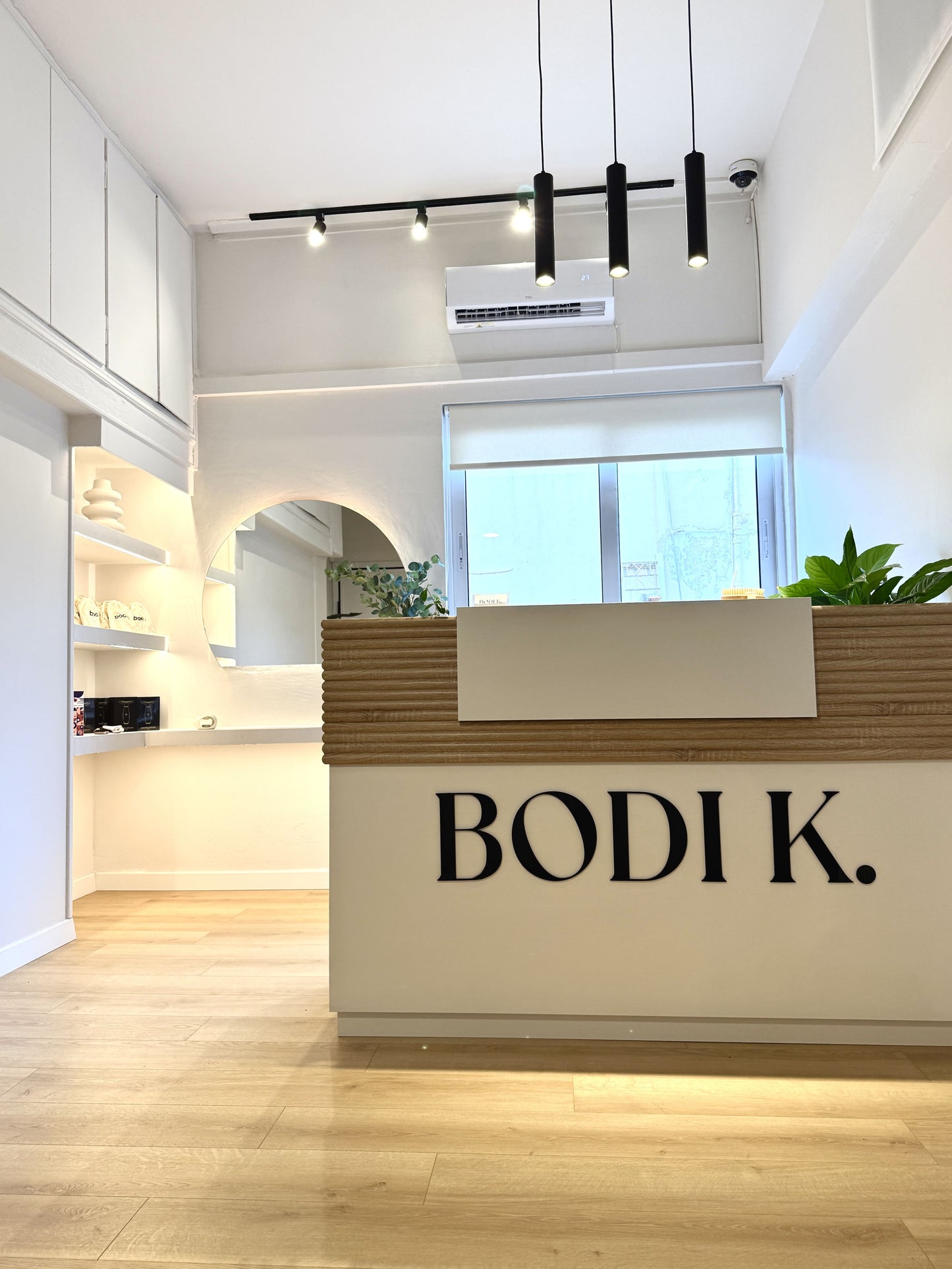 BODIK wellness studio reception area with minimalist interior and wooden front desk